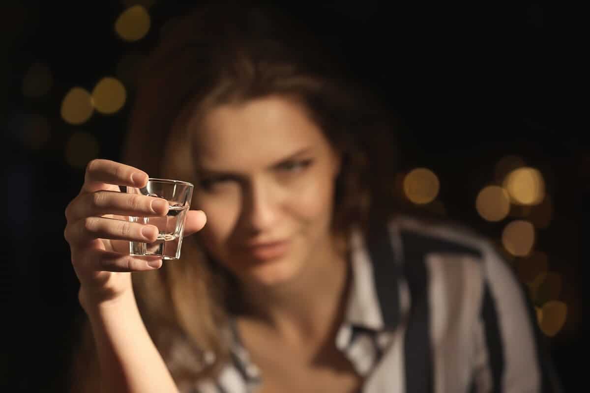 woman drinks a shot which brings up the question does alcohol kill brain cells